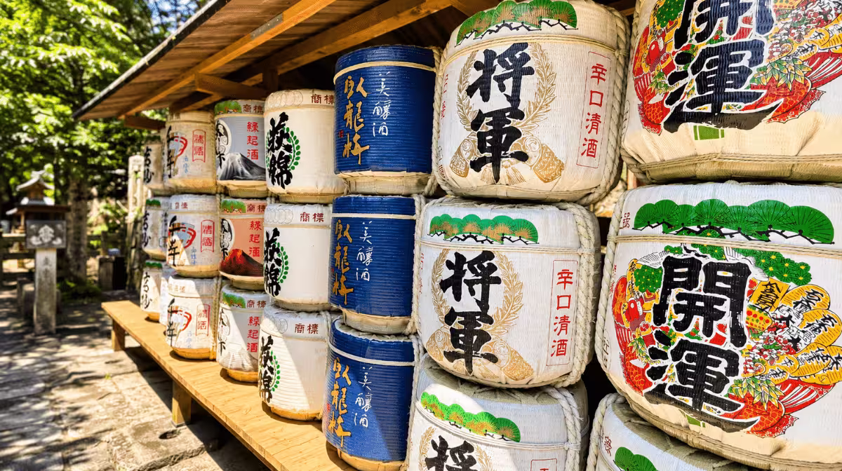 Rows of colorful sake barrels at Kunozan Toshogu Shrine, our own photo