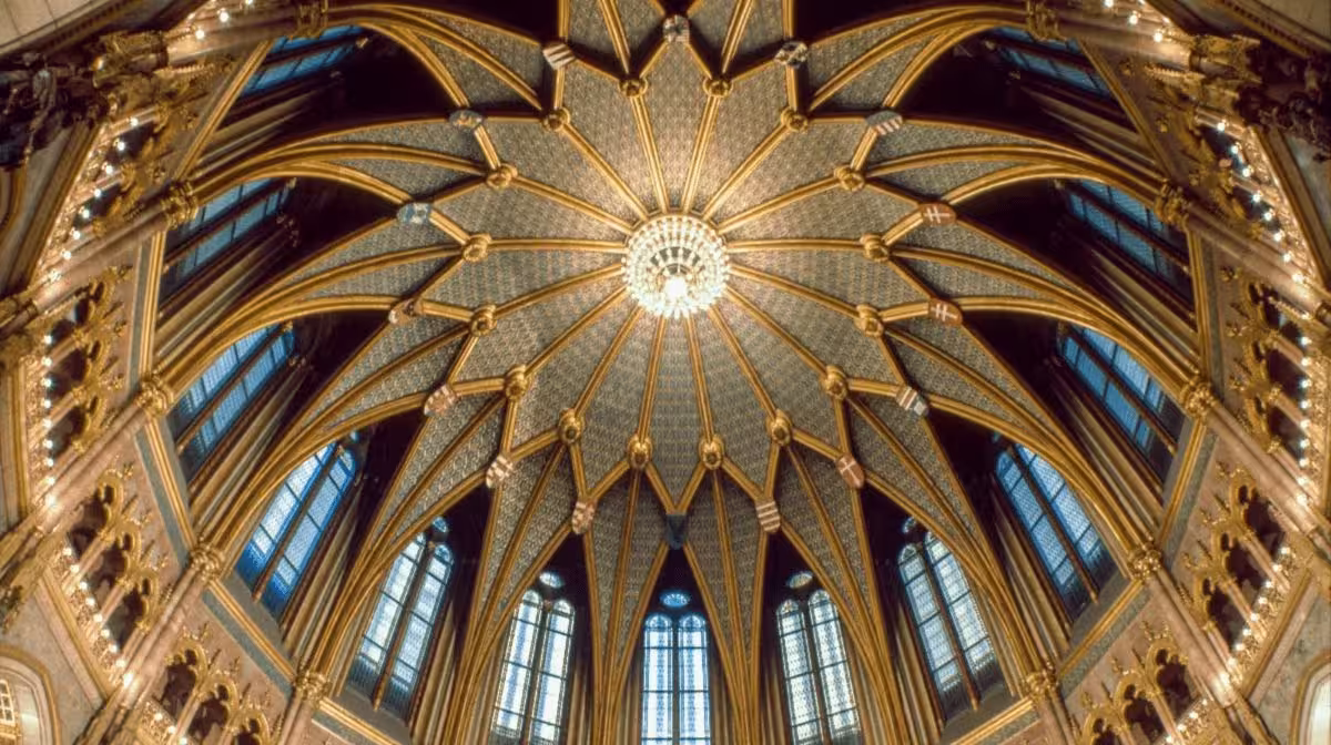 Gold-decorated dome interior inside the Hungarian Parliament Building, Budapest