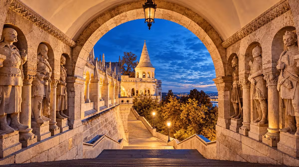 Fisherman's Bastion in Budapest illuminated at night with views over the Danube