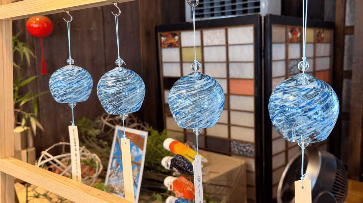 Hand-blown glass wind chimes (furin) on display in an Otaru glass shop — the ones we brought home