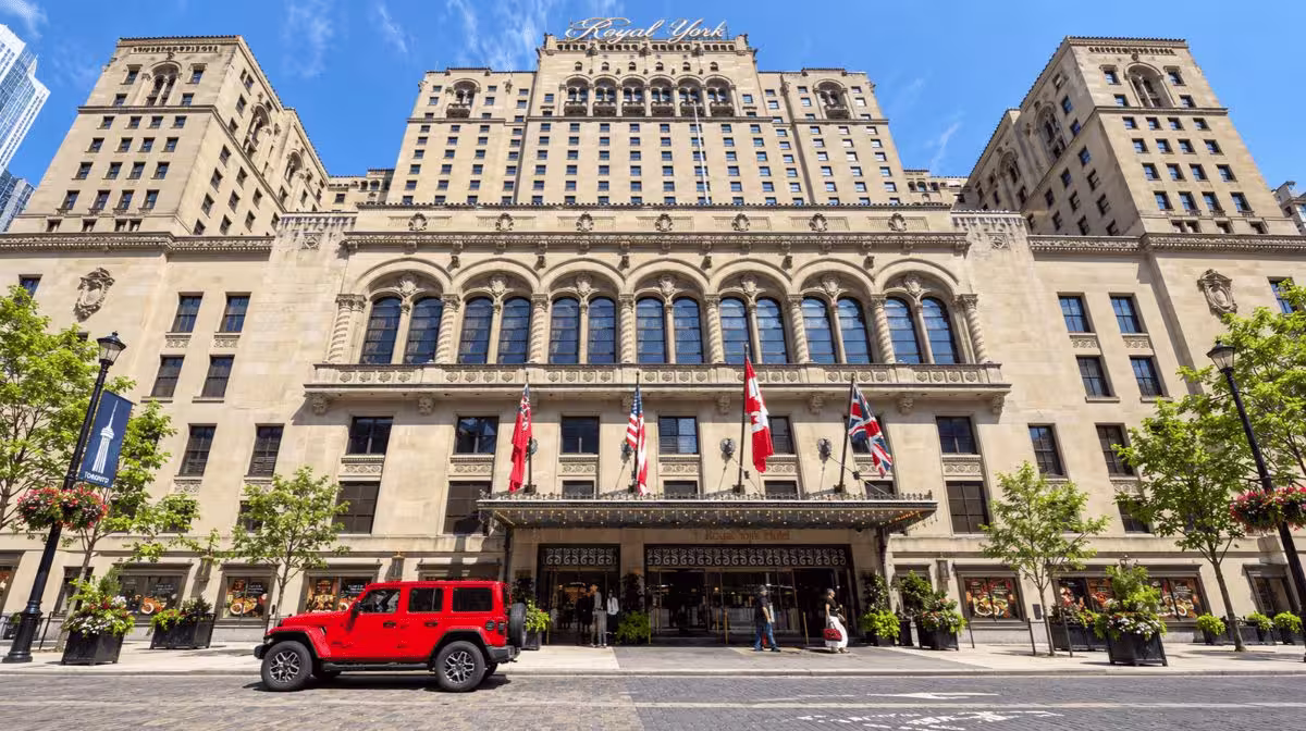 Fairmont Royal York hotel in Toronto with rental car parked outside