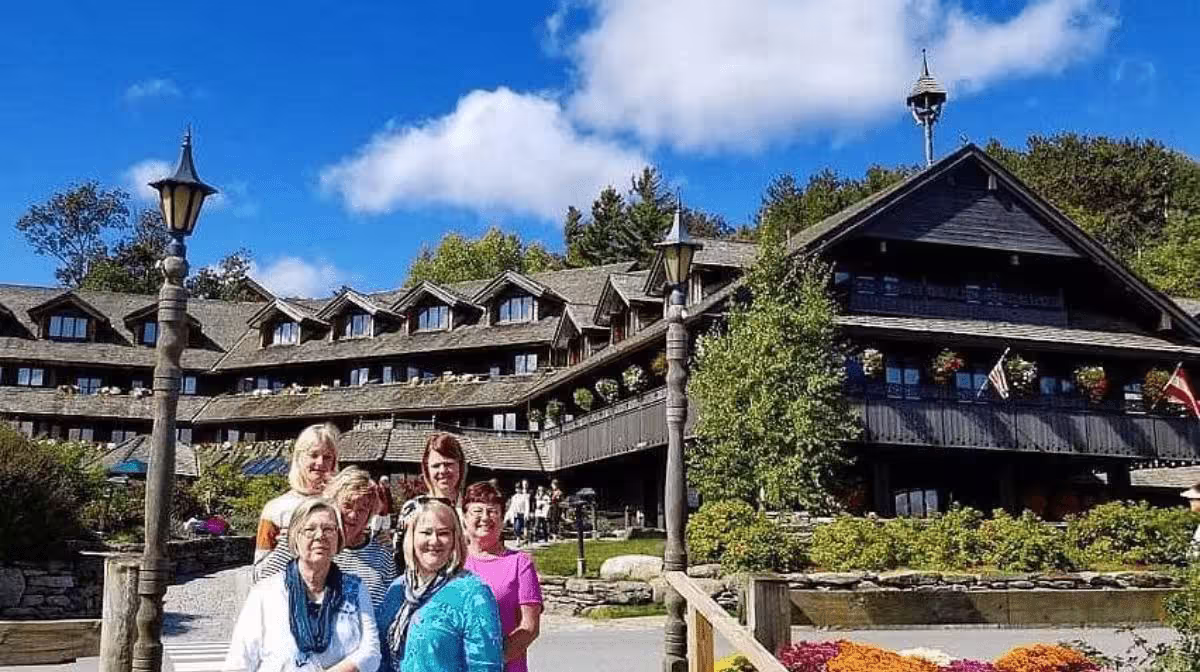 Small group tour van in Stowe, Vermont with fall foliage