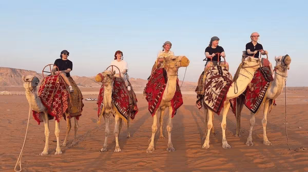 Camel ride on the red sand dunes near Riyadh